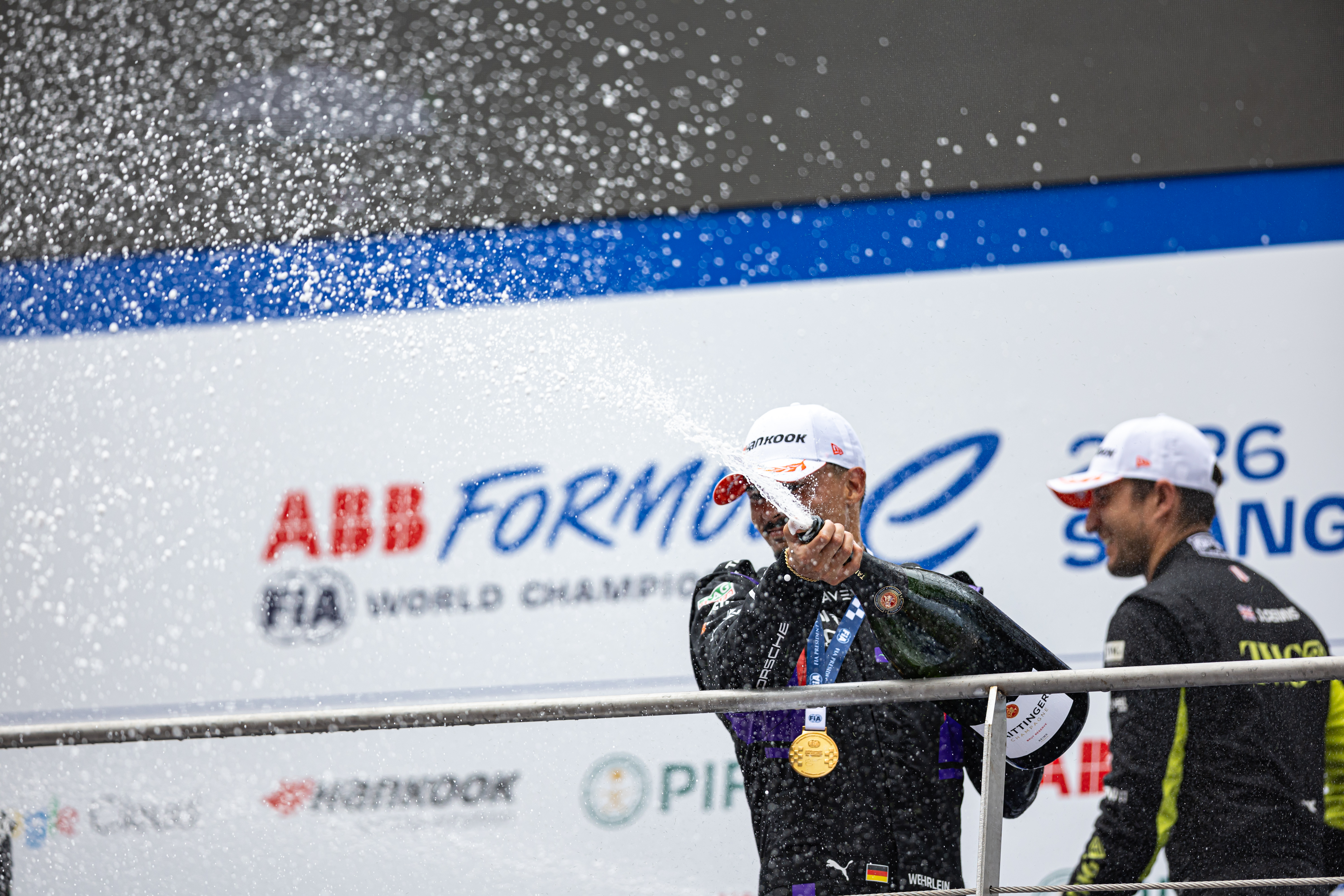 Champagne celebration on a motorsport podium